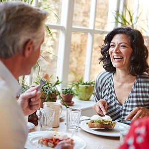 Woman enjoying a meal with friends